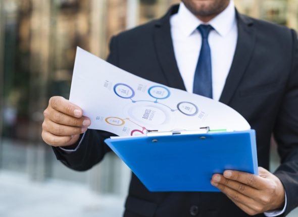 front-view-business-man-looking-charts