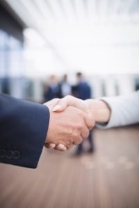 Close-up of businesspeople shaking hands